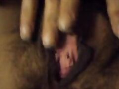 Hairy MILF wife fingers and fondles her pussy